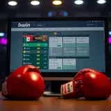 Close-up of a computer screen displaying Bwin boxing betting options with boxing gloves and a Nigerian flag in the background